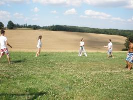 Victor and Quentin palying football with friends